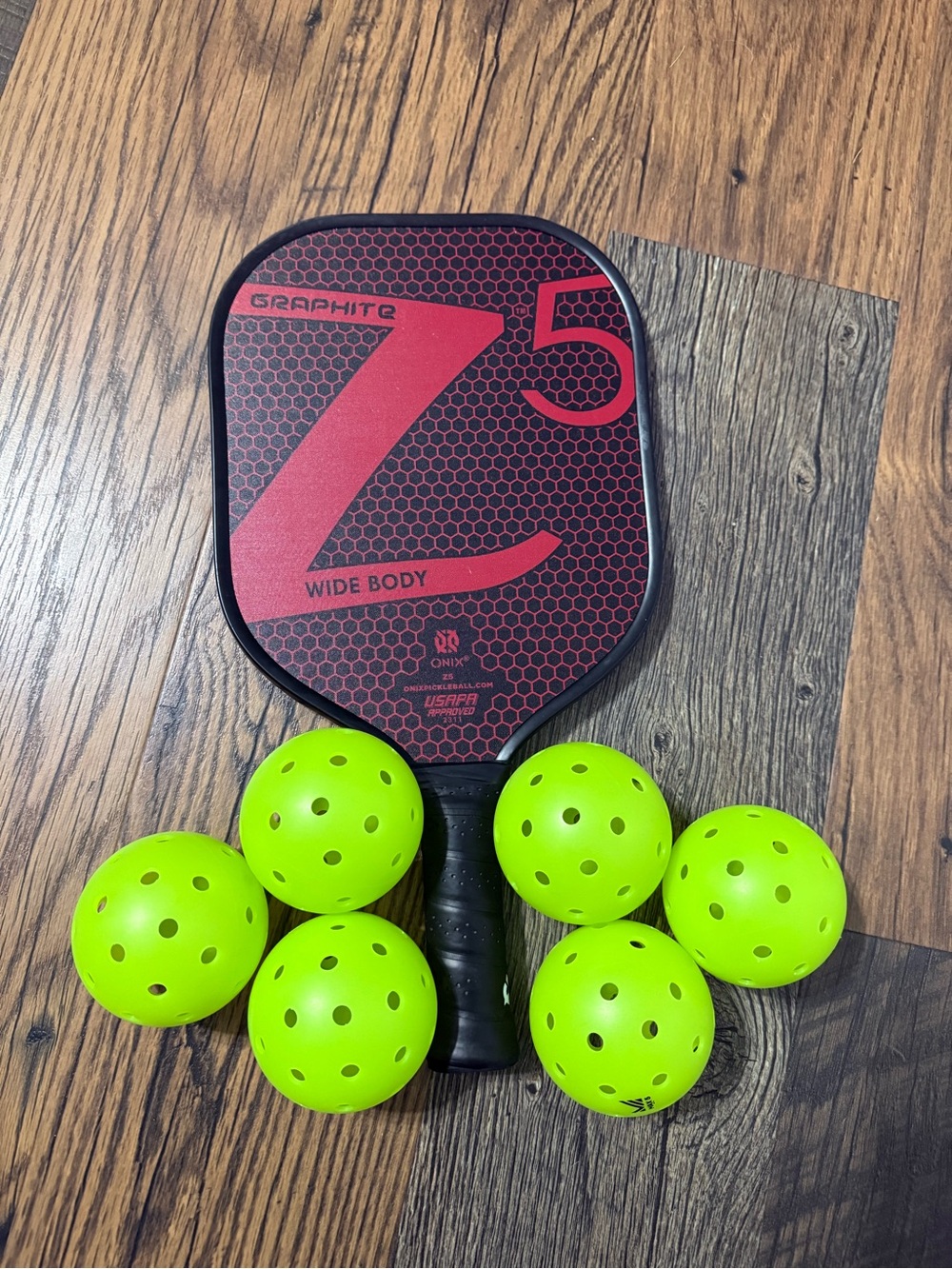 Onix Graphite Z5 Wide Body Pickleball Paddle with Six Neon Balls
